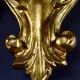 Pair of walled carved wood wall lamps