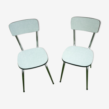 2 water green Formica chairs