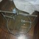 Glass coffee table with swivel tops circa 1980