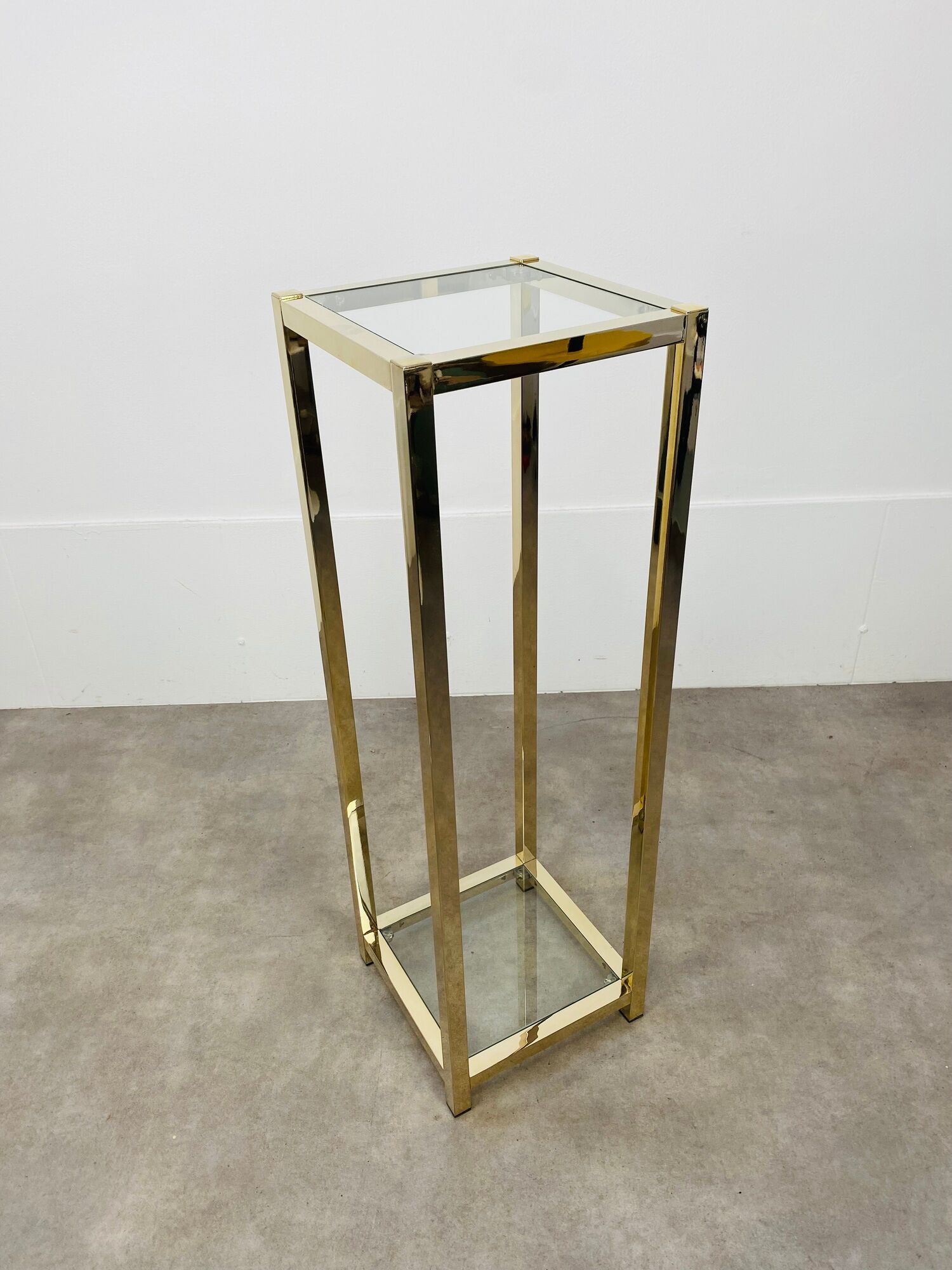 Gilded metal fifth wheel column and Hollywood Regency style glass 70s