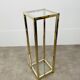 Gilded metal fifth wheel column and Hollywood Regency style glass 70s