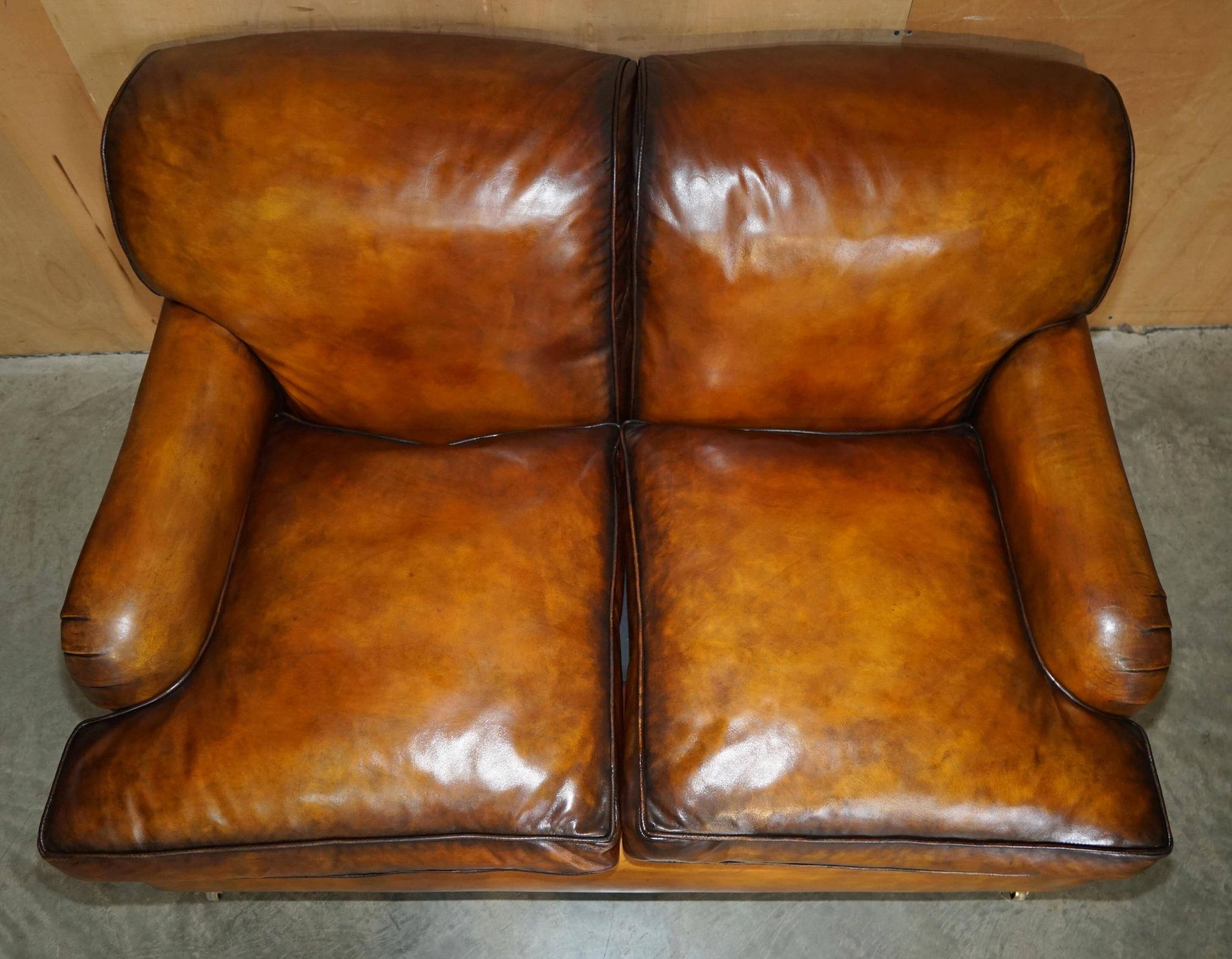 Howard & Son restored leather canapé, width 145 cm