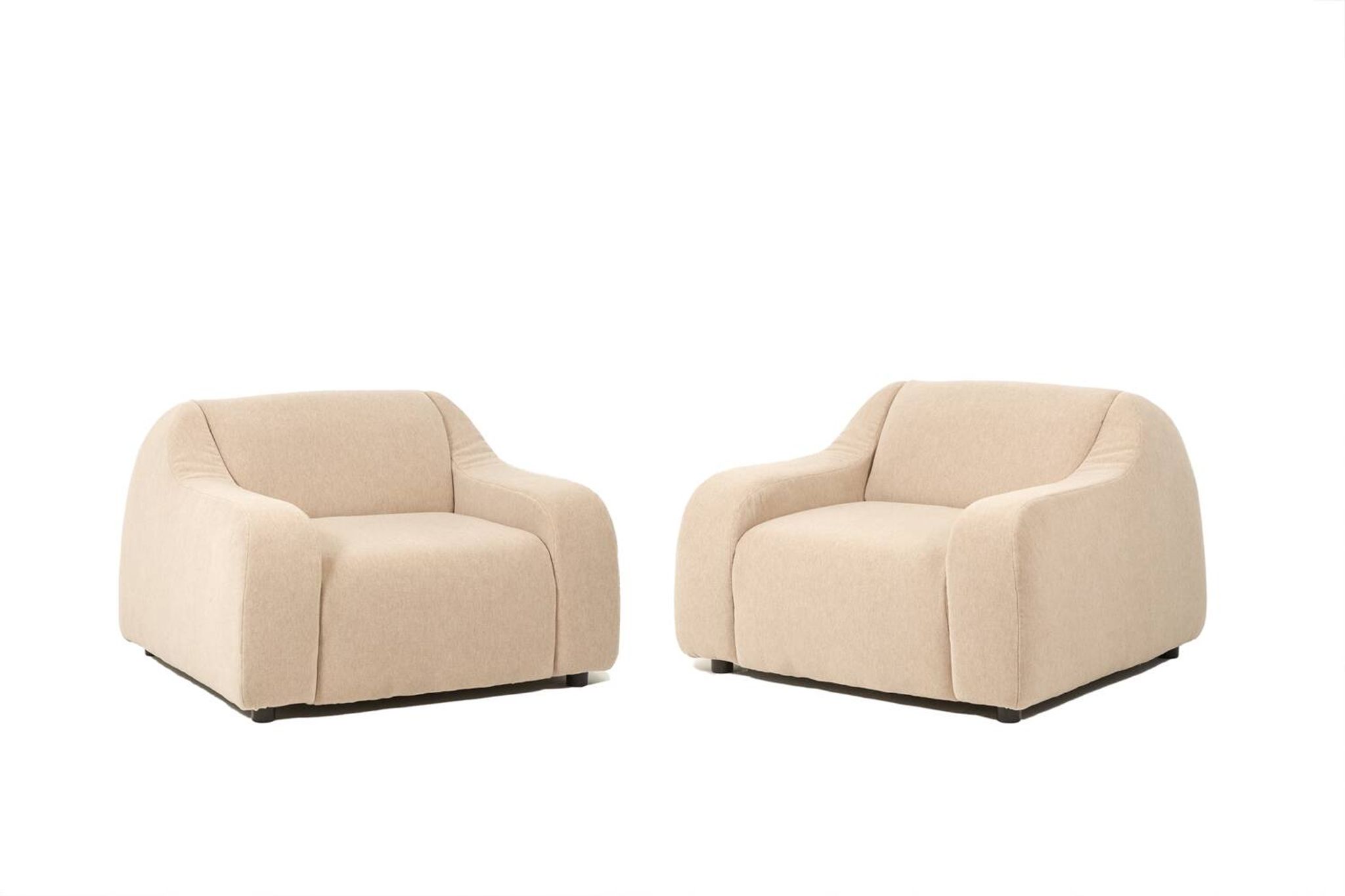 A pair of large and comfortable beige fabric armchairs. Contemporary.