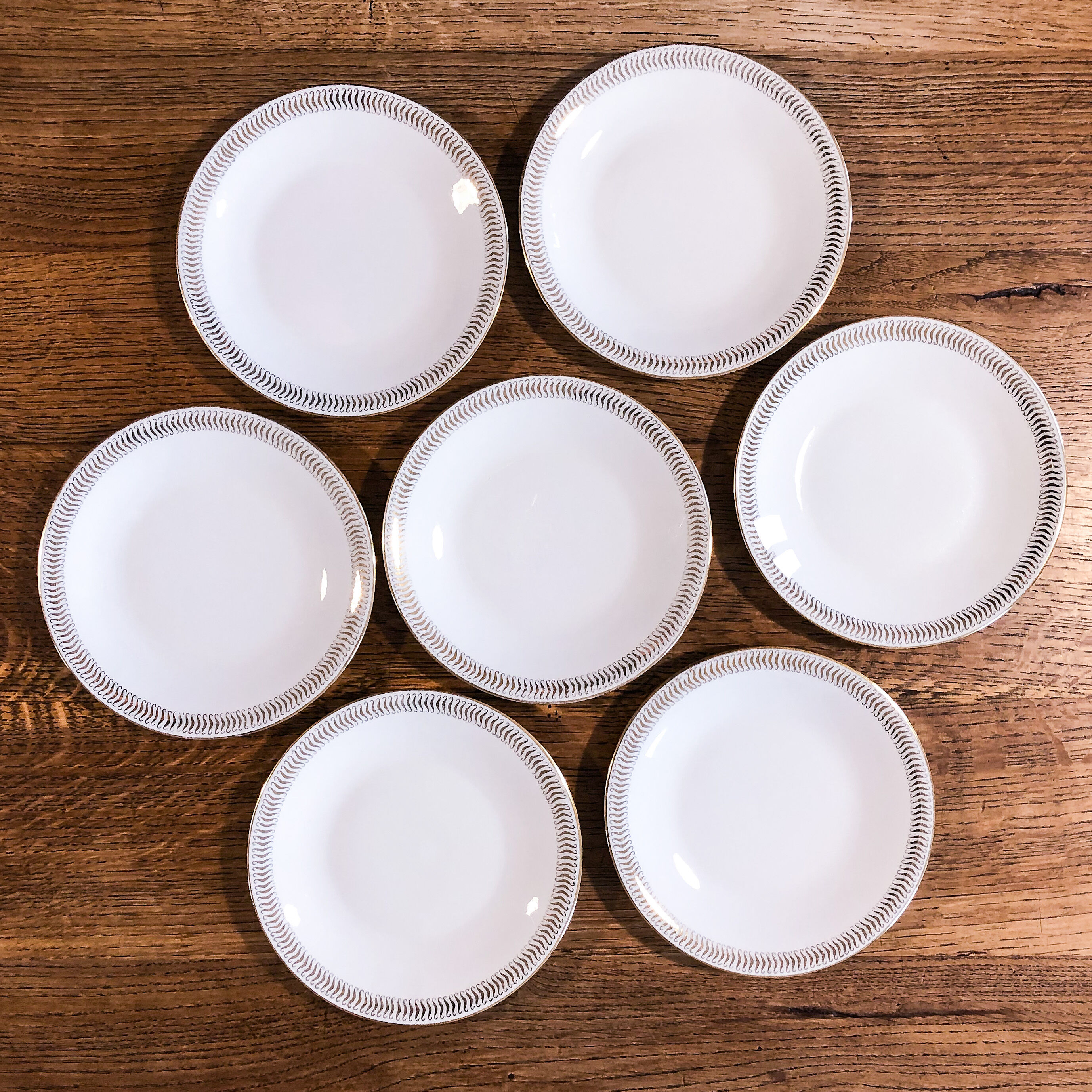 Set of 7 porcelain dessert plates from Limoges