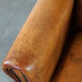 Charming and rugged sheepskin leather armchair, large model