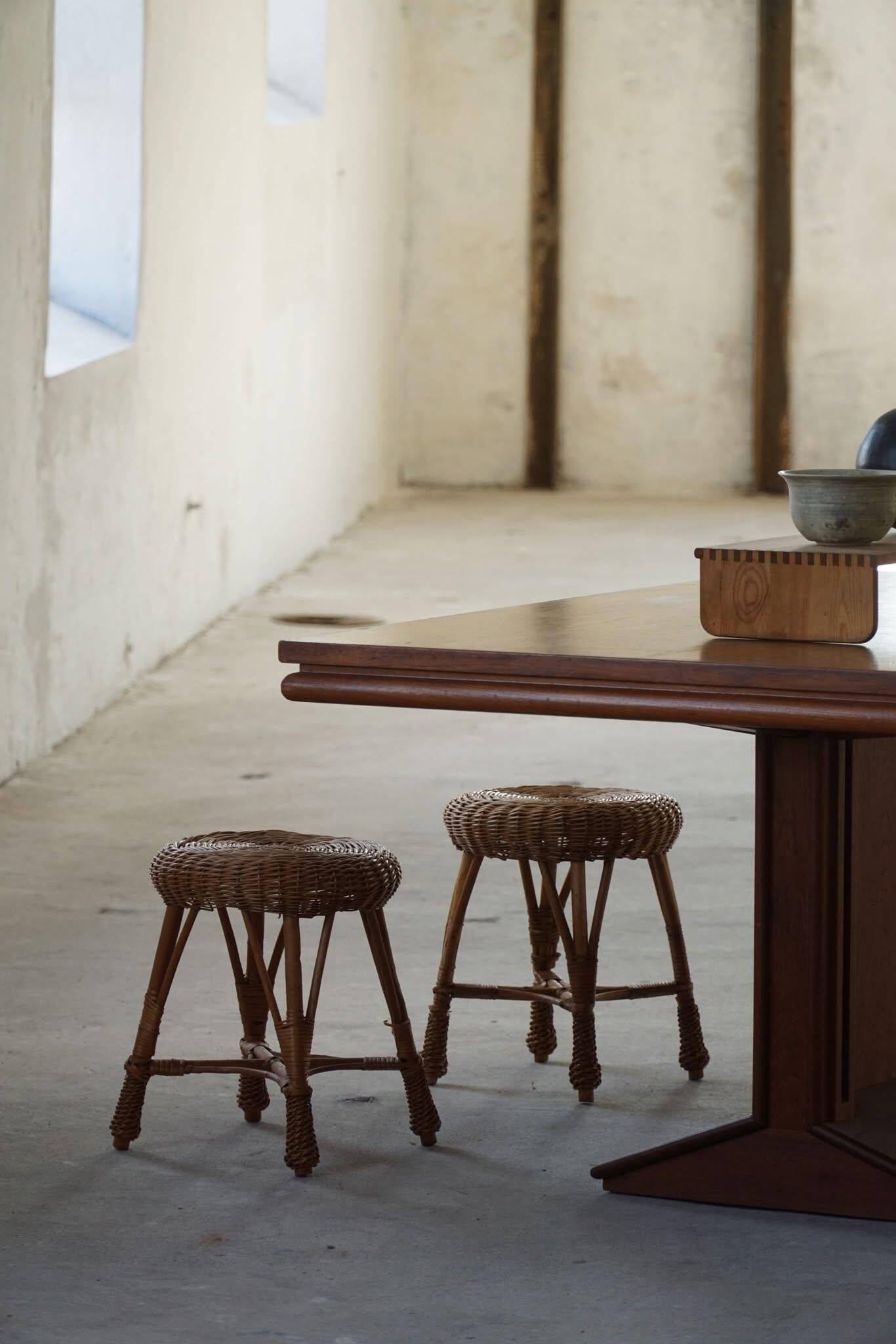 A set of 4 vintage Scandinavian rattan stools, in the style of Tony Paul, from the 1960s.