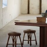 A set of 4 vintage Scandinavian rattan stools, in the style of Tony Paul, from the 1960s.