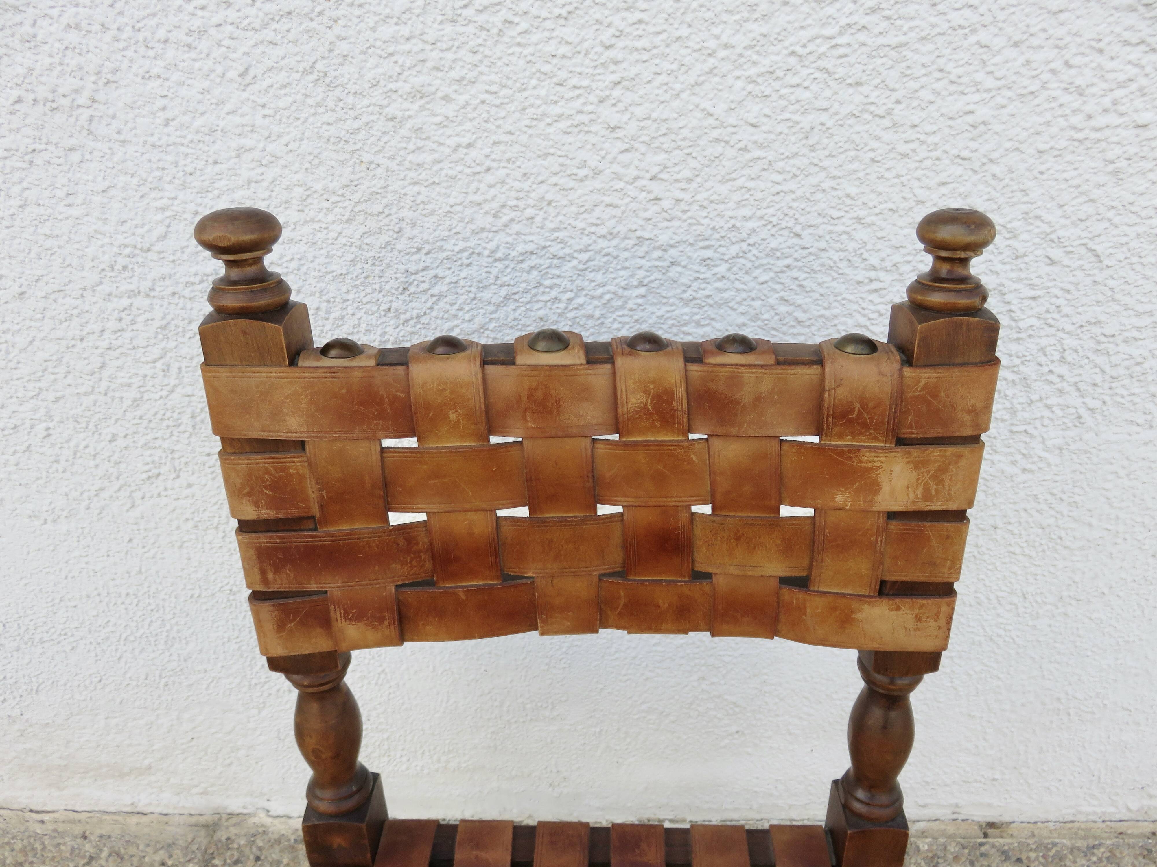 Spanish chair in oak with thick cognac leather straps, 1940s.
