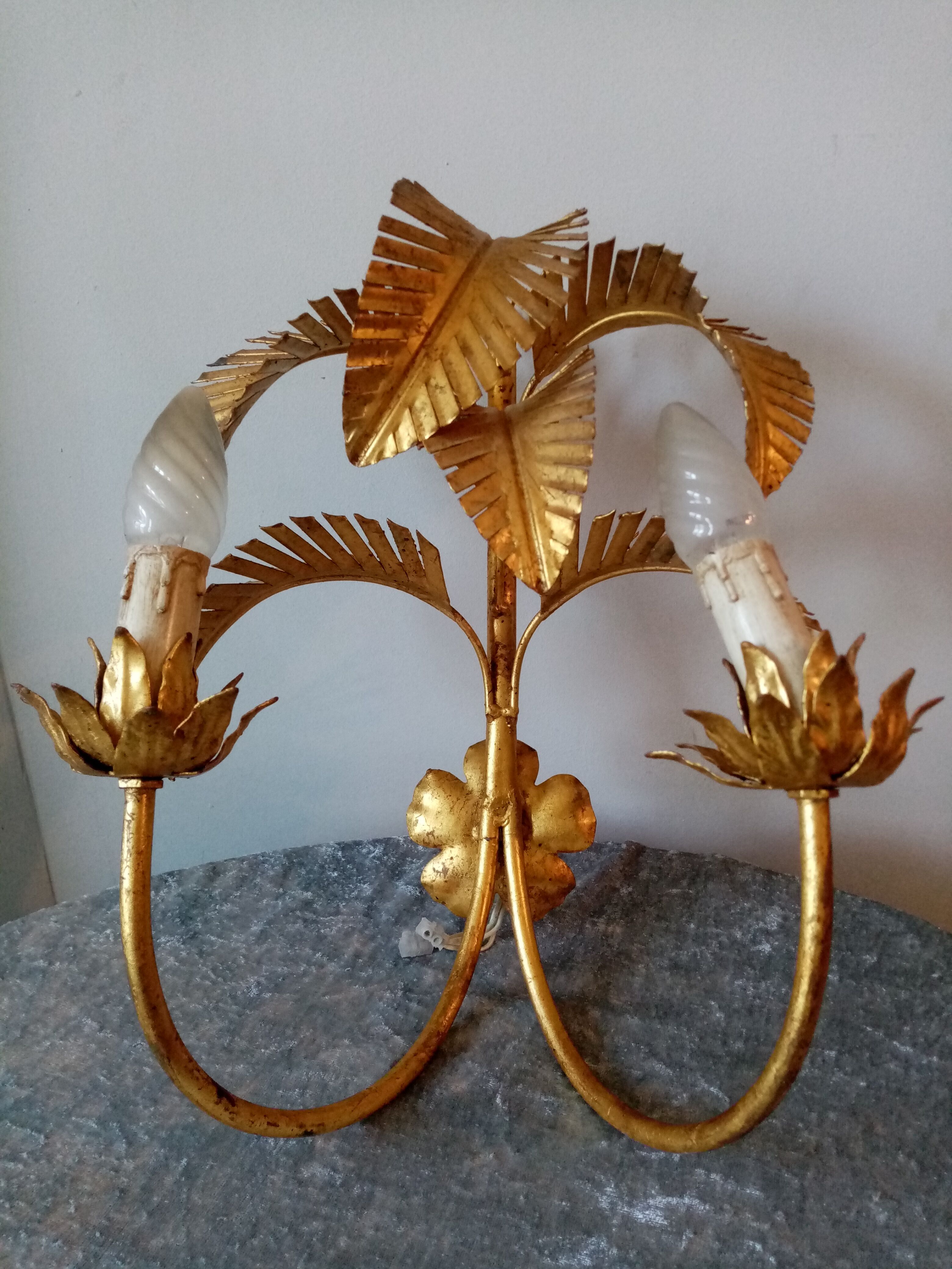 Old wall lamp palm shaped metal dore with leaf