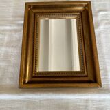 Bronze-colored framed mirror