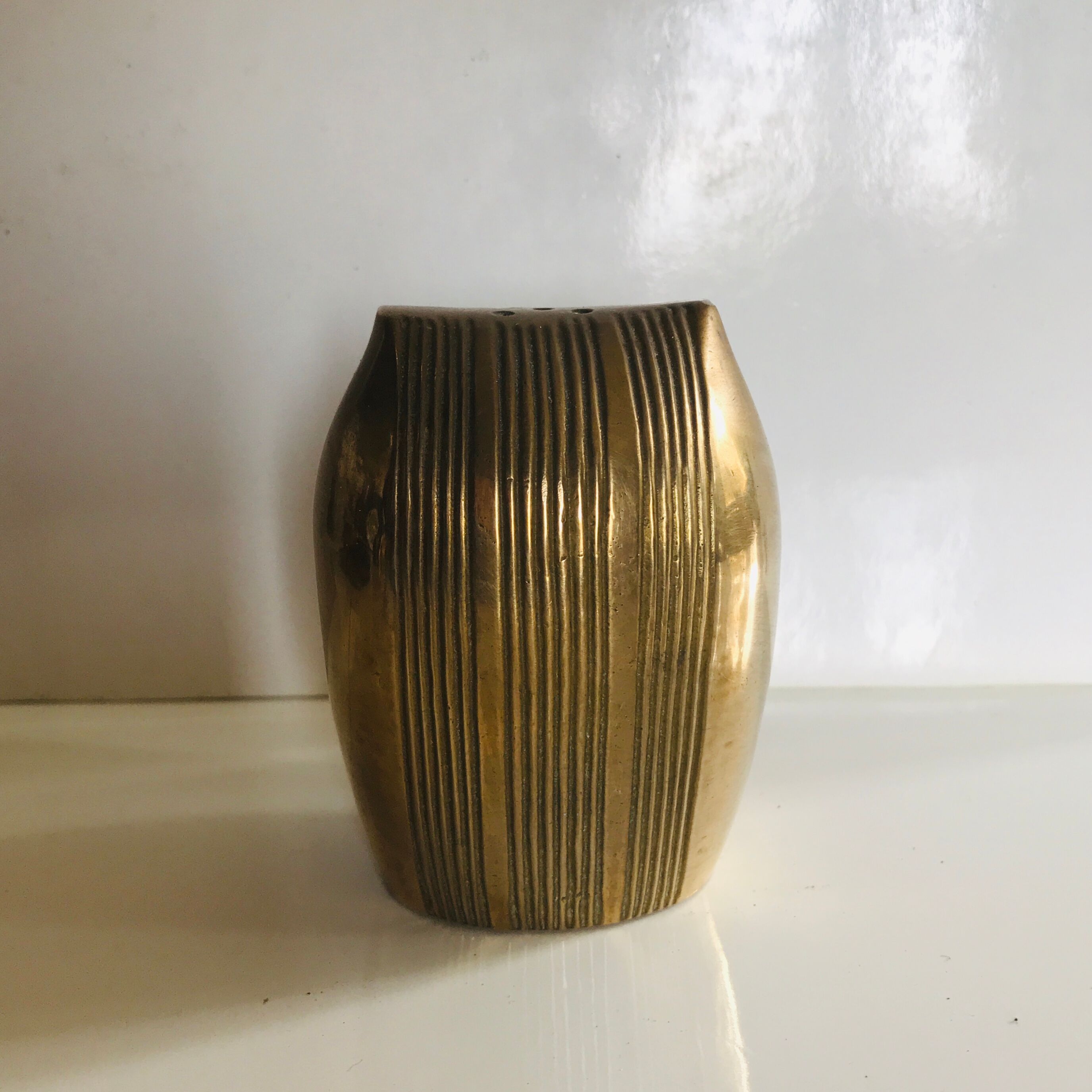 Brass owl wears incense