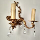 Rococo-style wall lamp in gilded bronze and crystal stamps