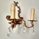 Rococo-style wall lamp in gilded bronze and crystal stamps