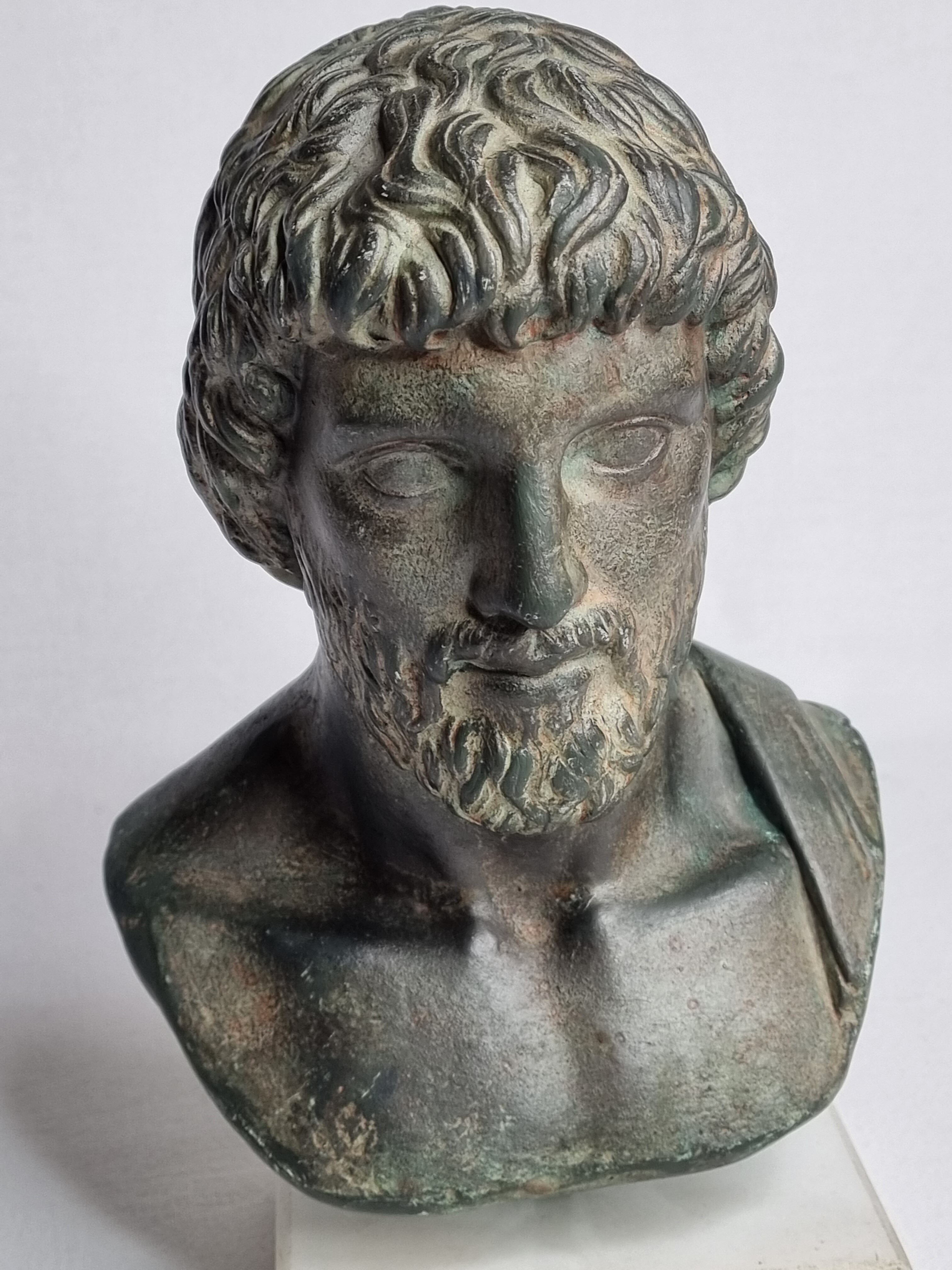 Bust of Esculape in patinated plaster on marble base, 21 cm