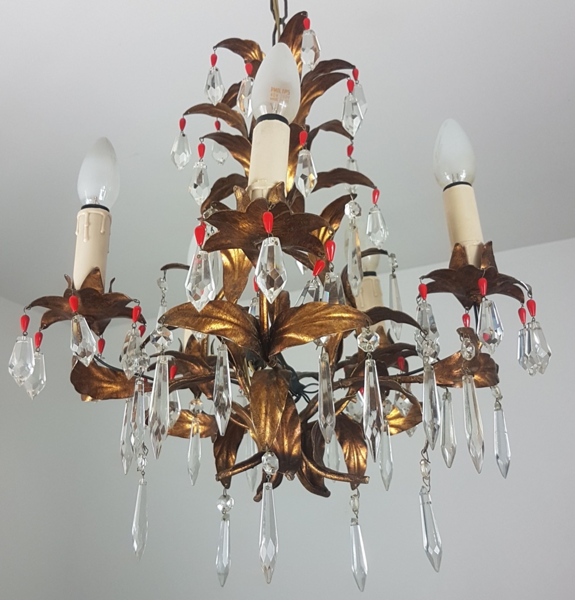 Gold metal chandelier and stamps