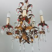Gold metal chandelier and stamps