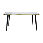 Low table with compass feet with decorative cabinet
