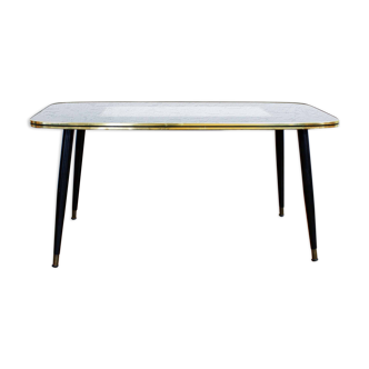 Low table with compass feet with decorative cabinet