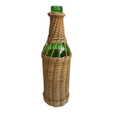 bottle surrounded by rattan 70s
