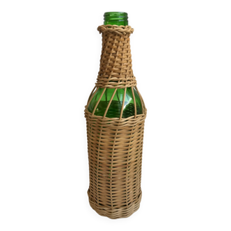 bottle surrounded by rattan 70s