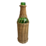 bottle surrounded by rattan 70s