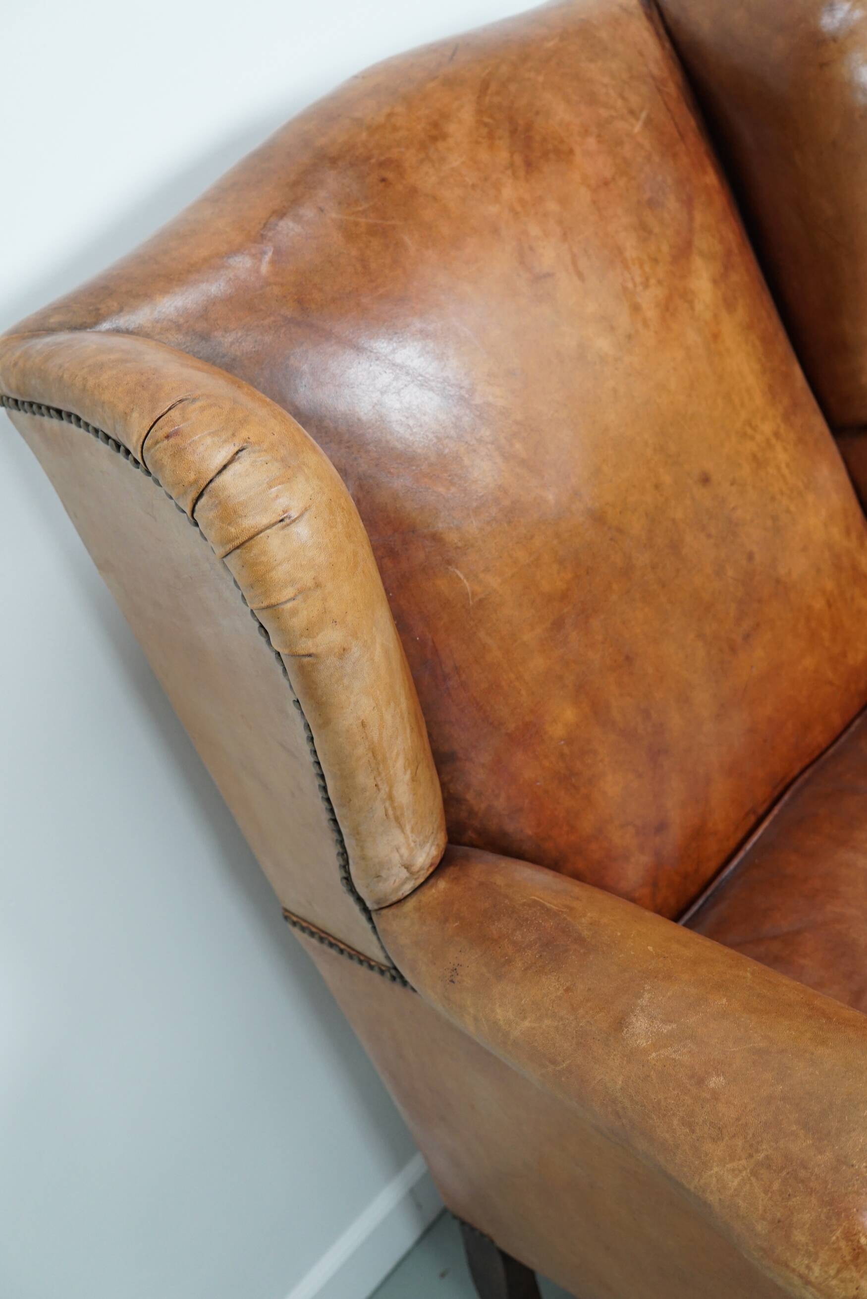 Vintage Dutch cognac coloured leather club chair, with footstool
