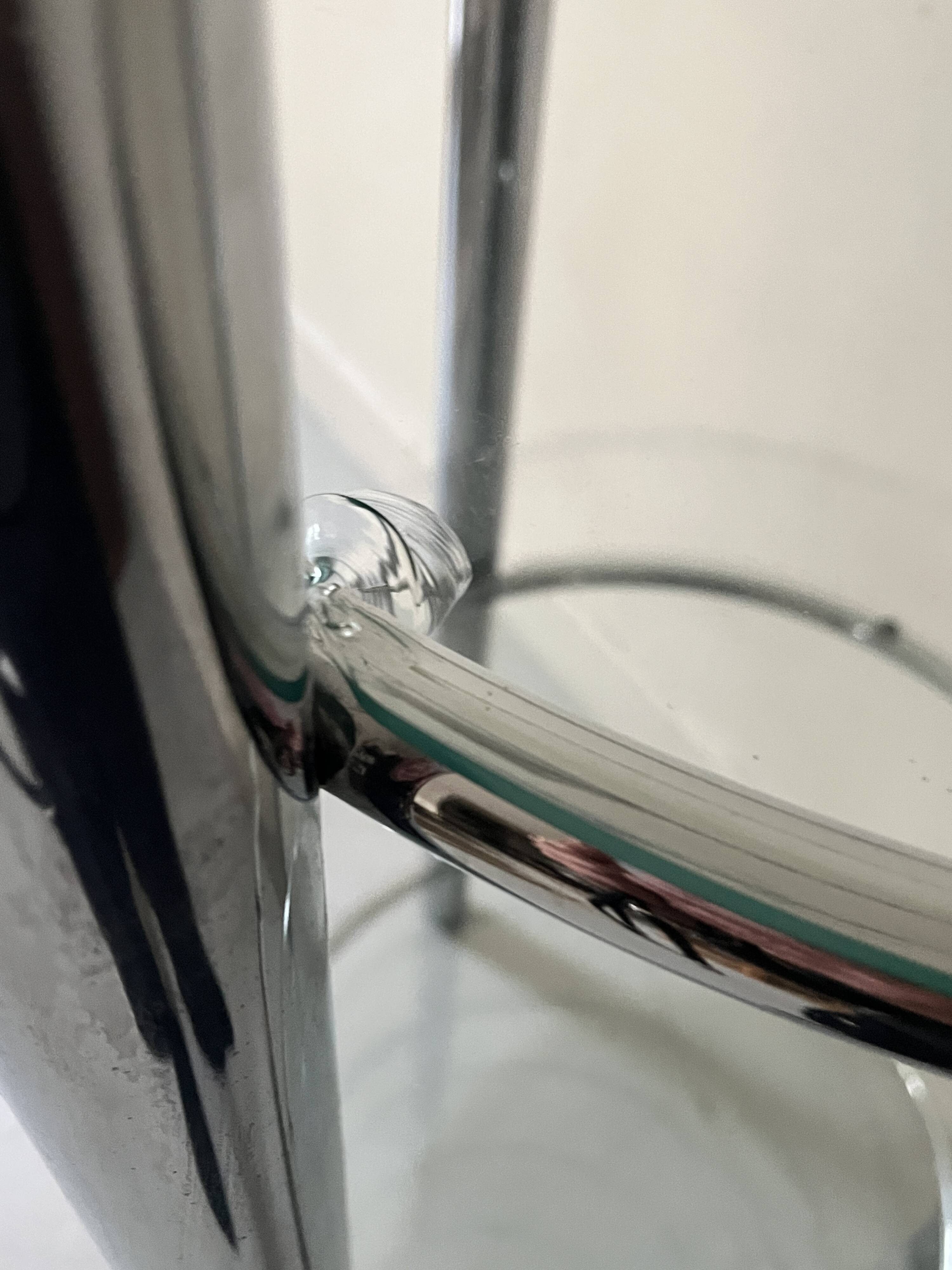 Round tubular bookcase in chrome and glass, 1970 design