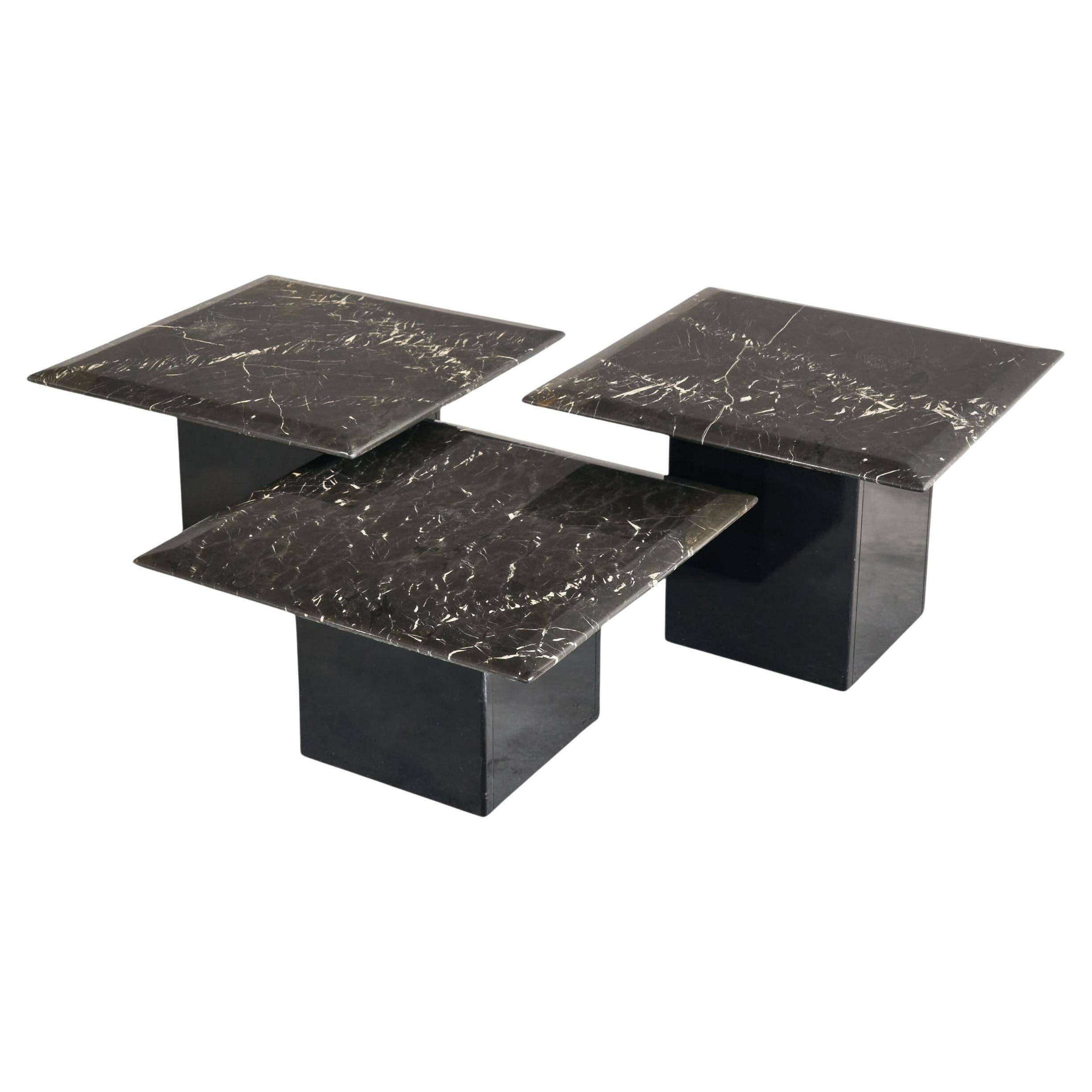 Set of 3 marble and lacquer coffee tables, 1970s.