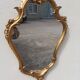 Pair of mirror Baroque style Louis XV gilded