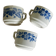 Set of 3 antique ceramic cups with blue floral pattern.