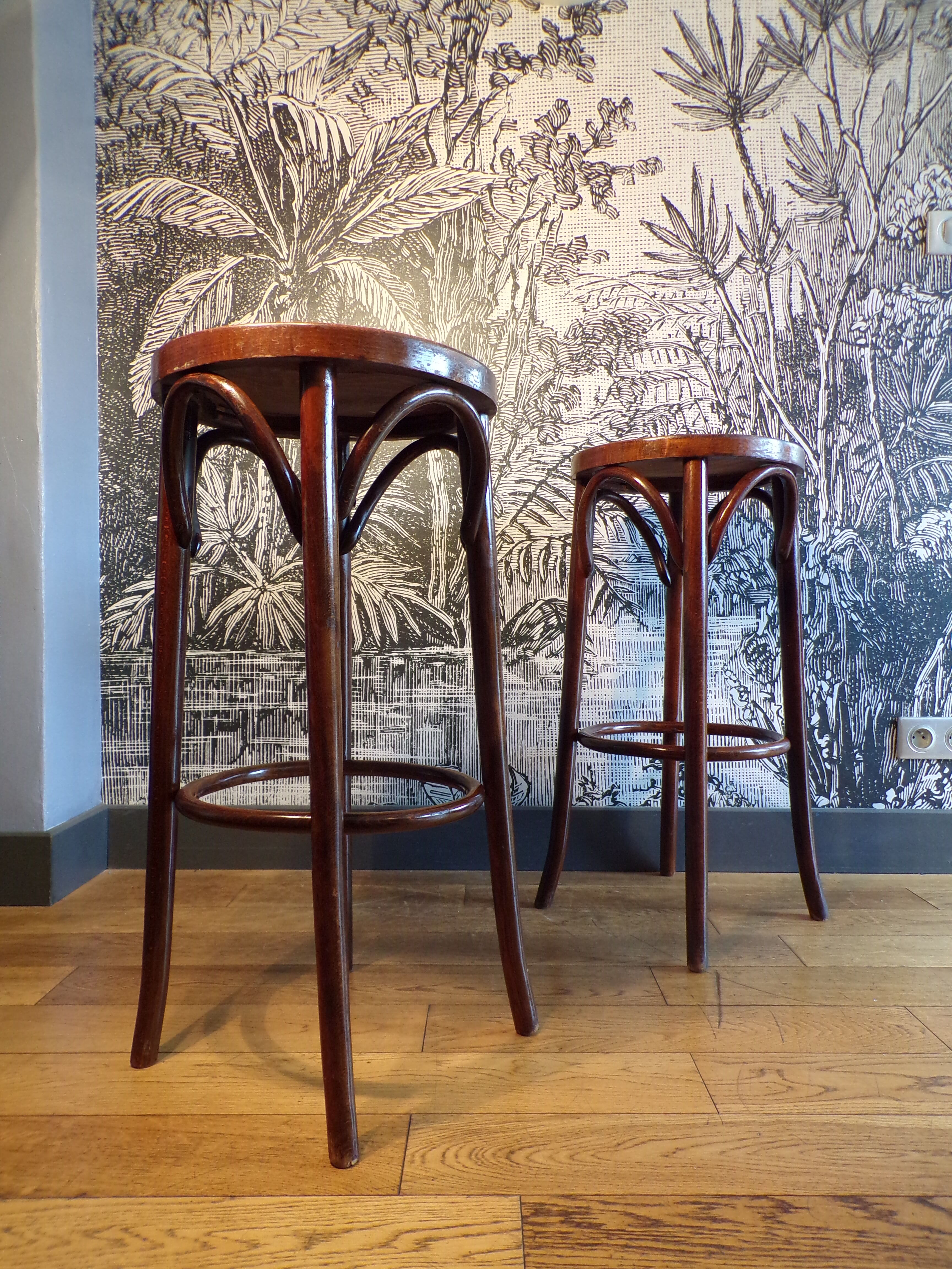 2 curved wooden bar stools