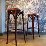2 curved wooden bar stools