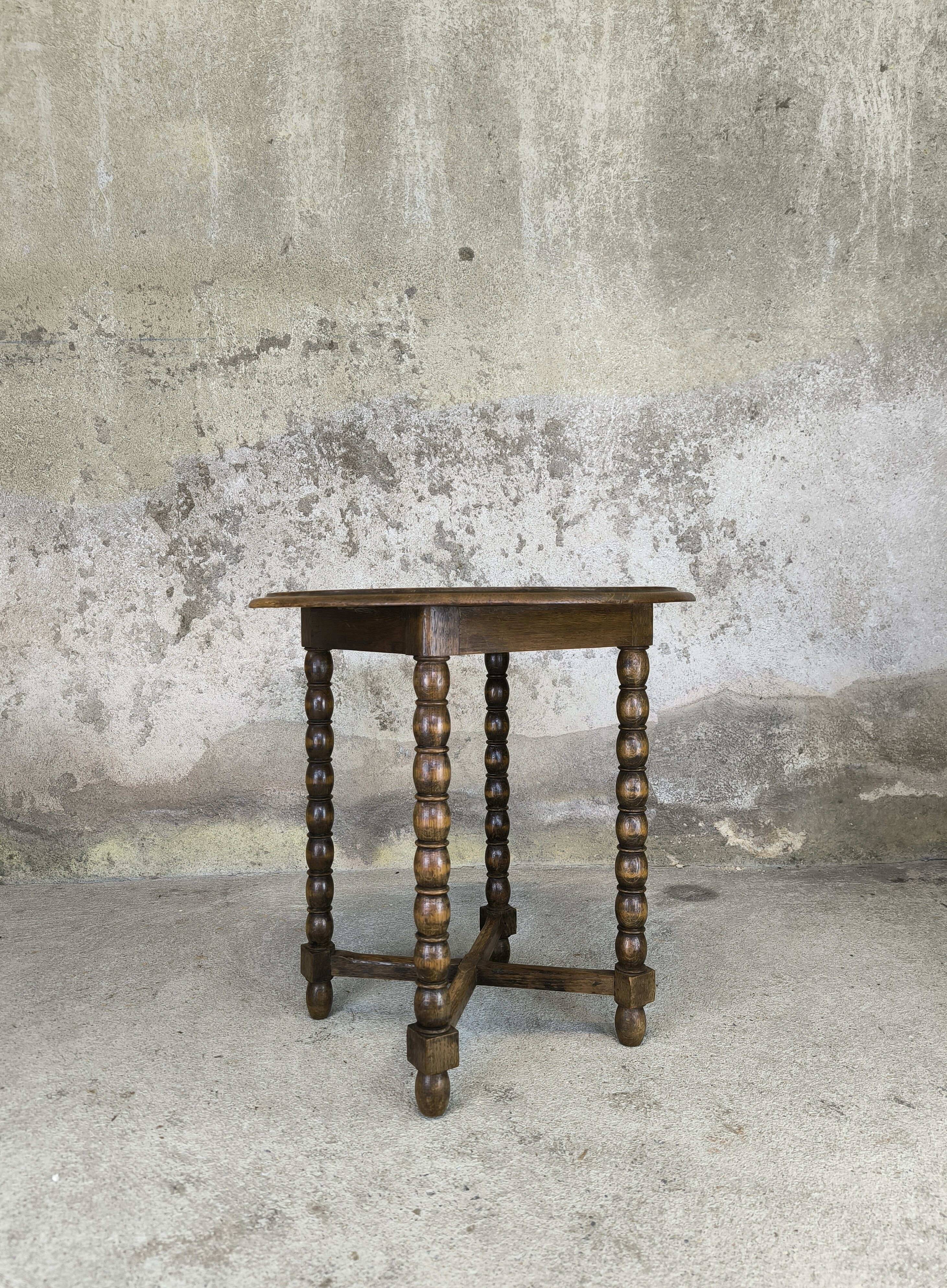 Vintage gueridon with beaded wooden legs.