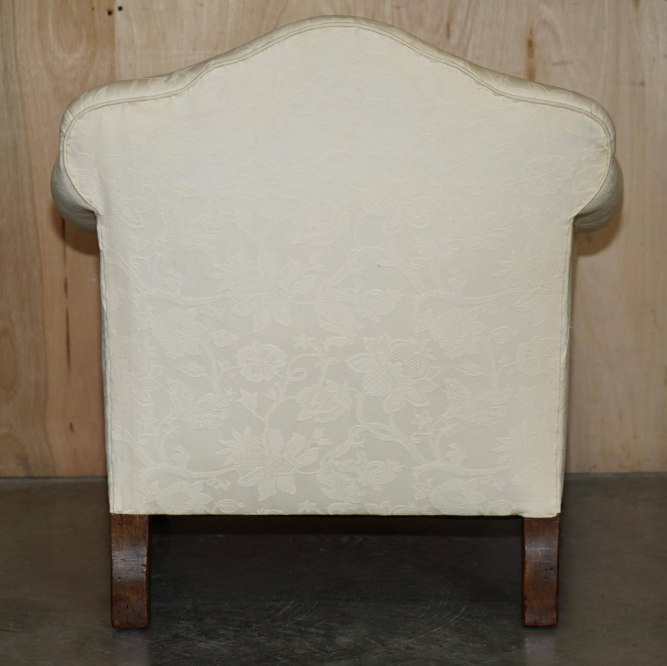 Pair of Edwardian armchairs from 1910 with carved legs and fabric.