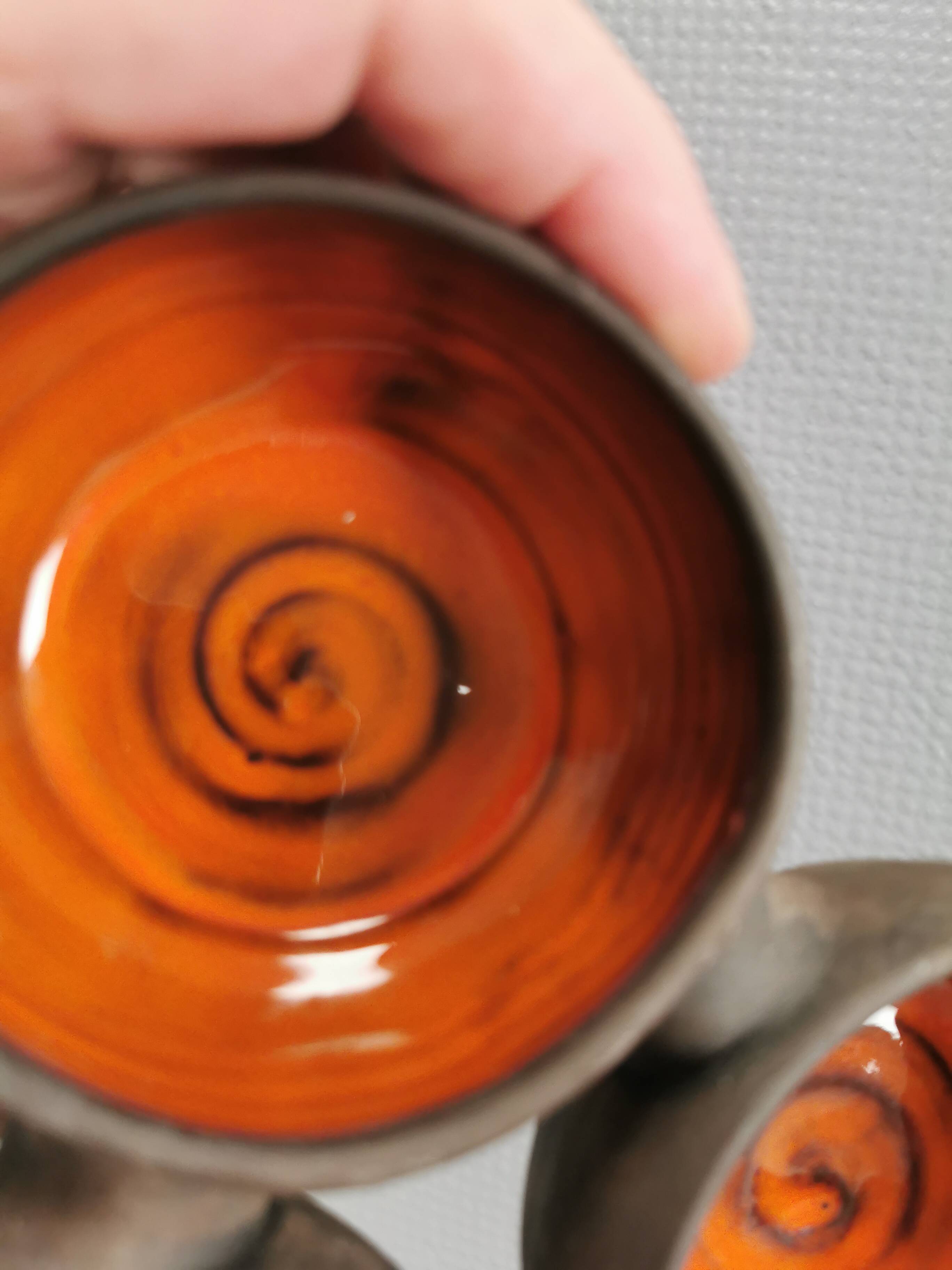 Beautiful bowl (composed of 3 bowls) with orange/red glaze inside