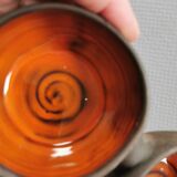 Beautiful bowl (composed of 3 bowls) with orange/red glaze inside