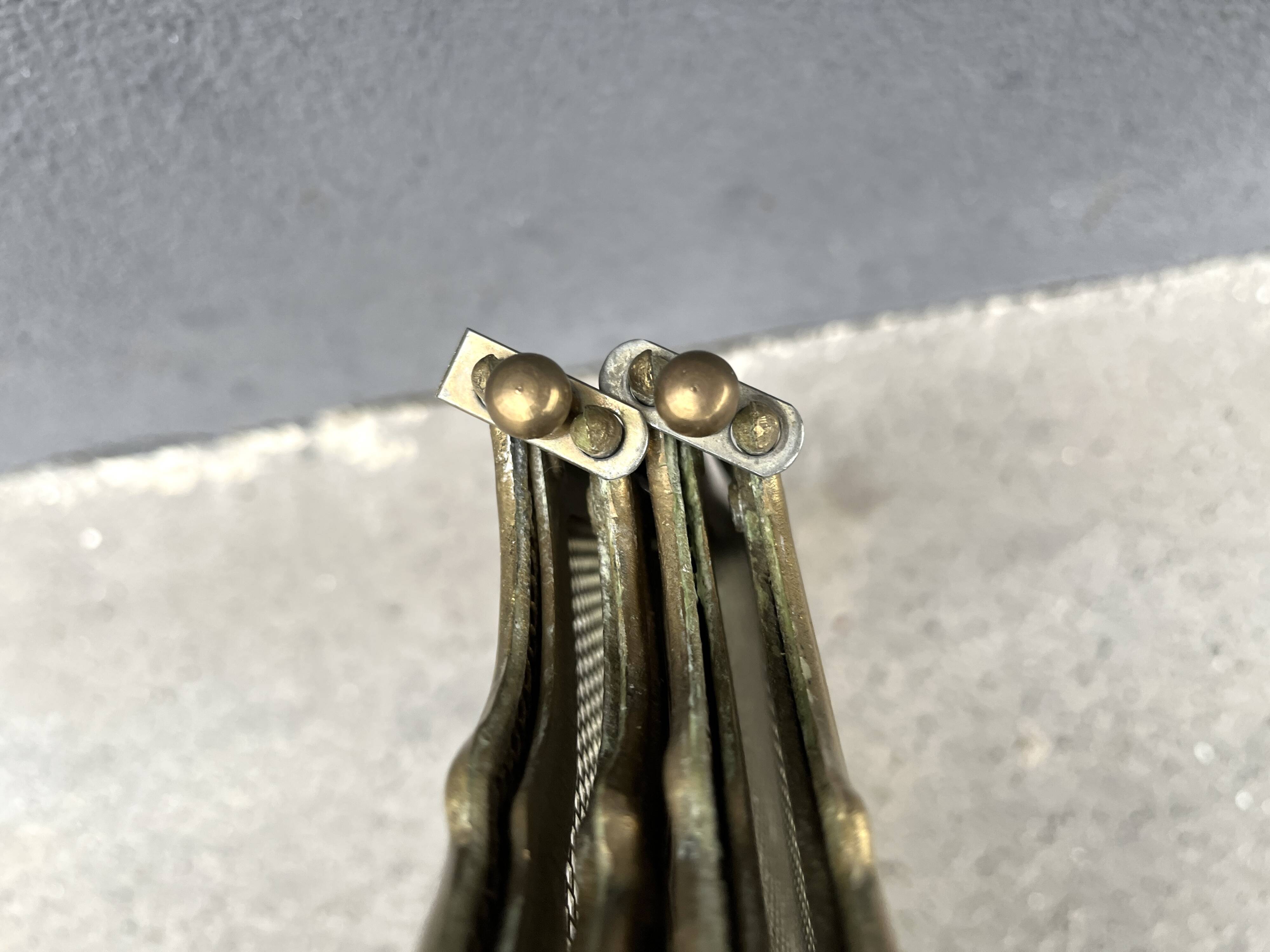 Antique brass fireplace screen from 1920, vintage spark guard.