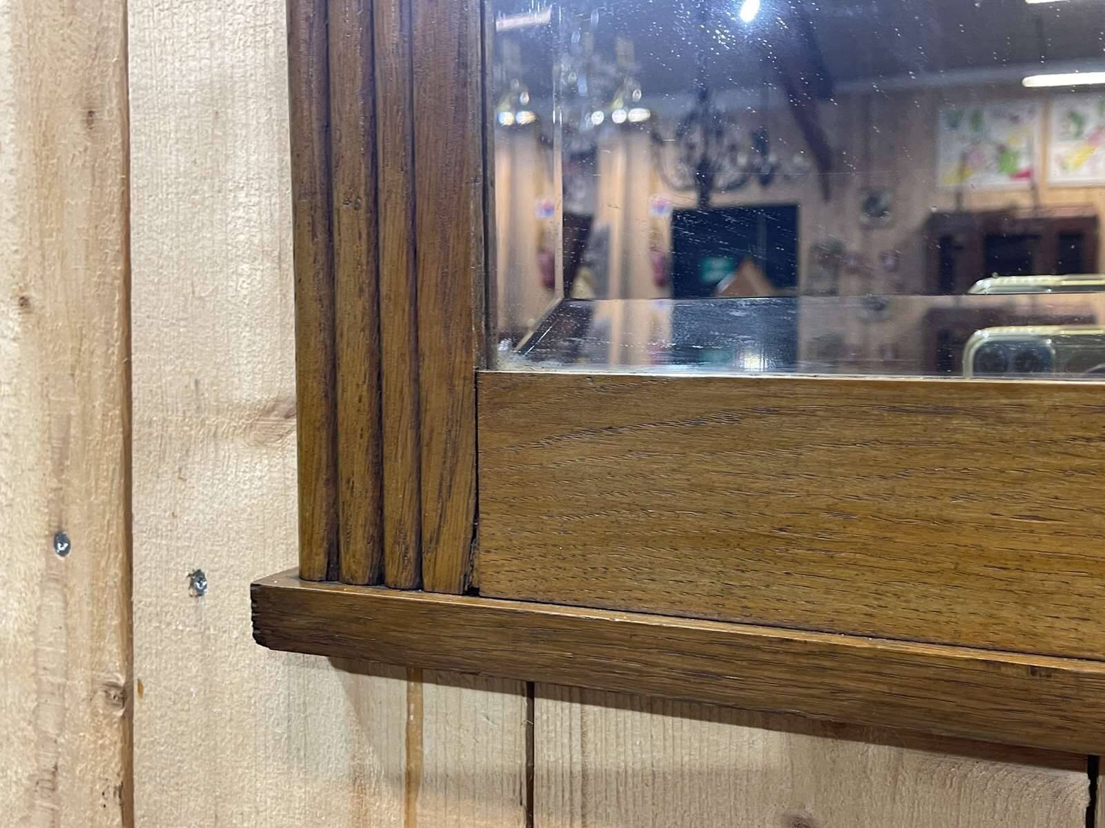 Art deco period beveled mirror in oak