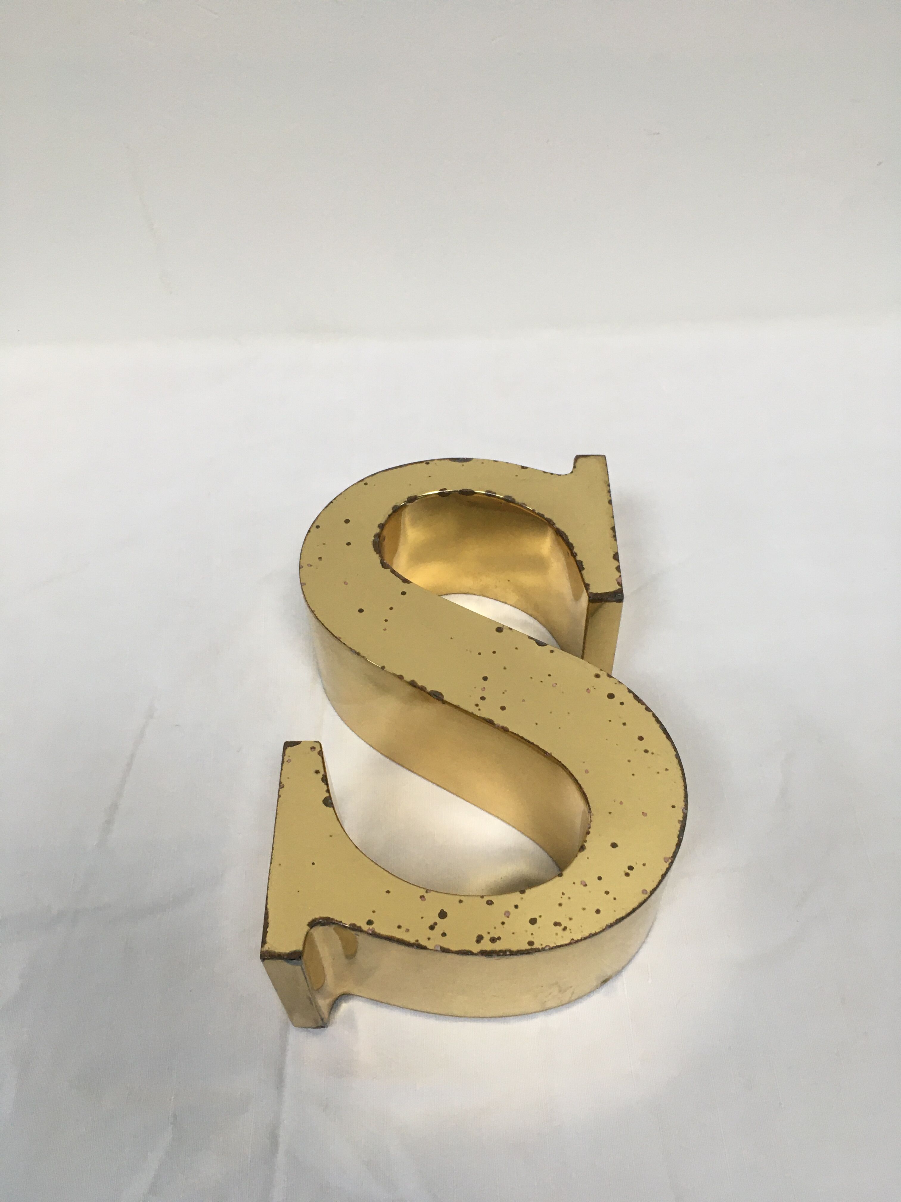 Brass sign letter S