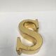 Brass sign letter S