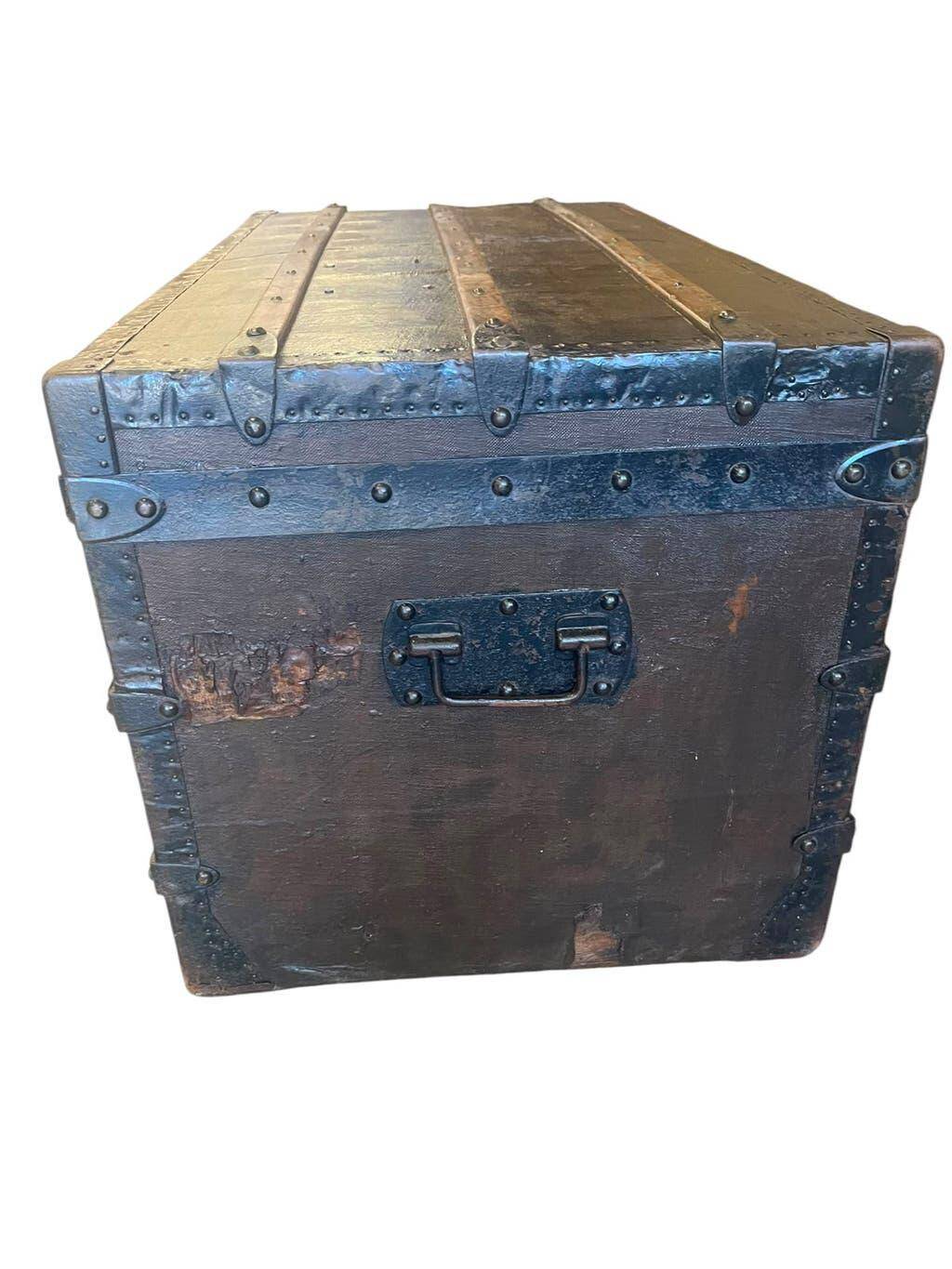Vintage wooden coffee table with iron fittings.