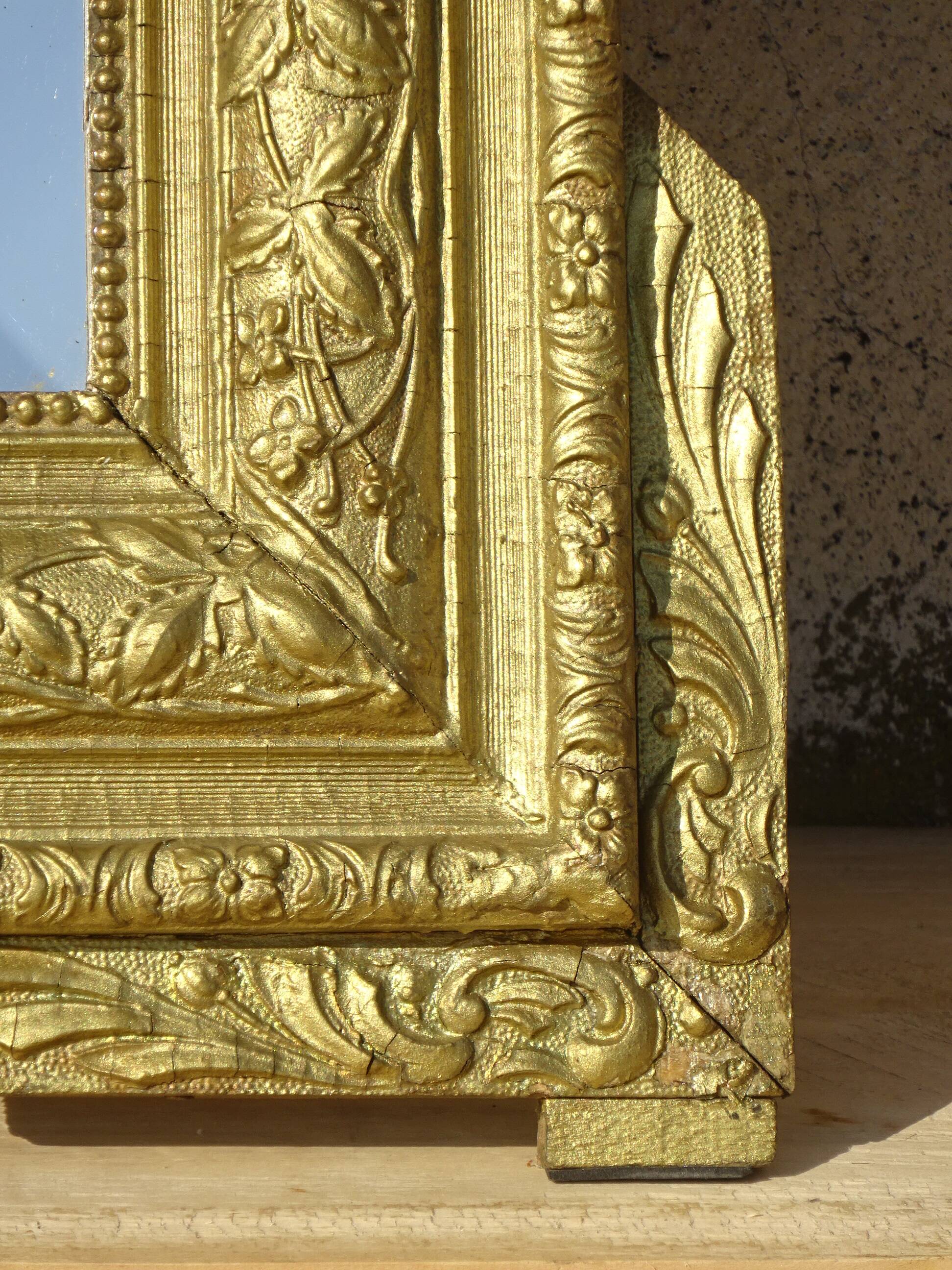 Antique mercury mirror in the Napoleon III style.