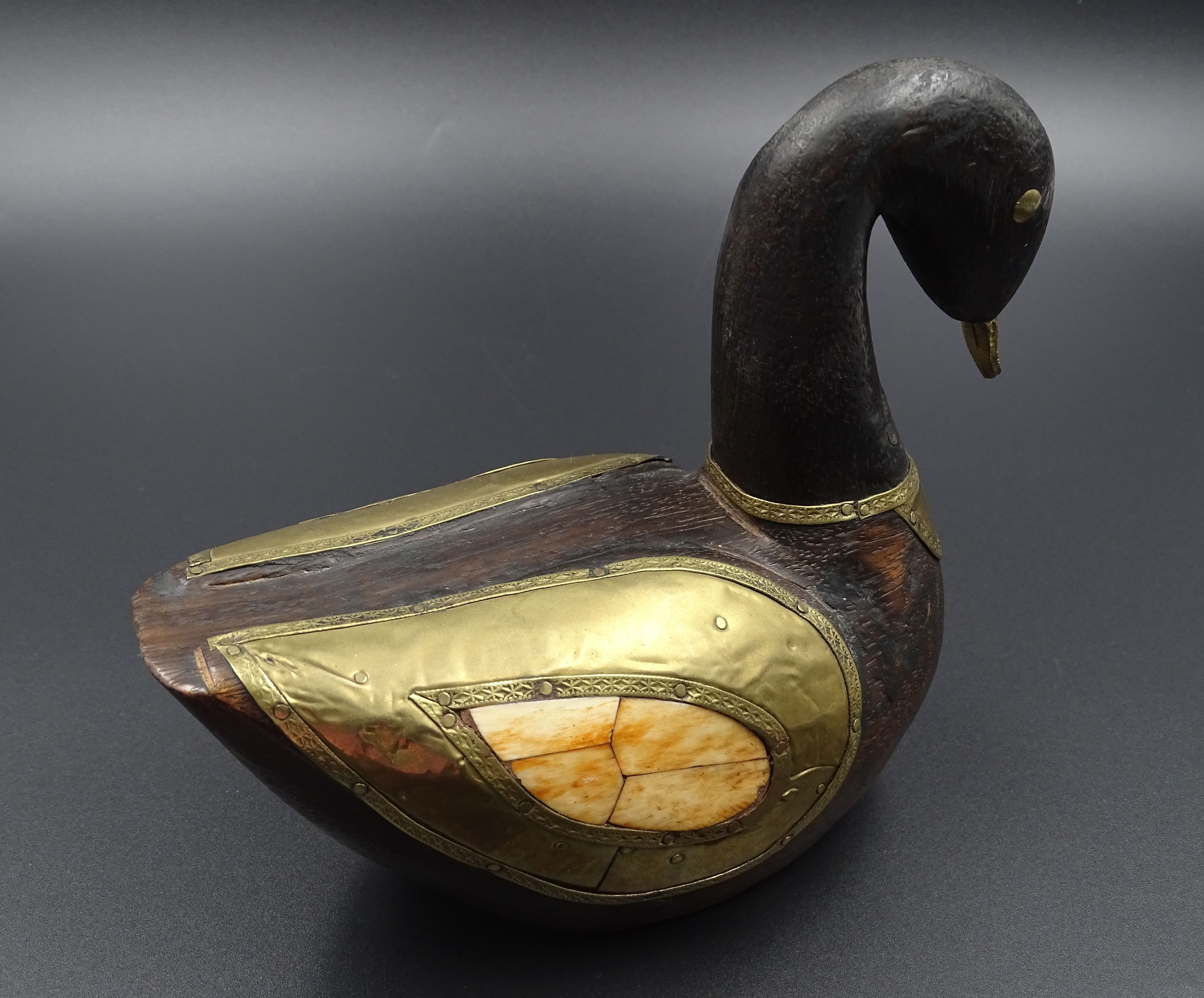 Wooden and brass swan