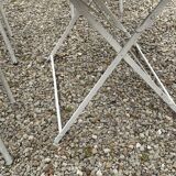 Garden furniture in wrought iron and wooden slats composed of two armchairs, 4 chairs and a table.
