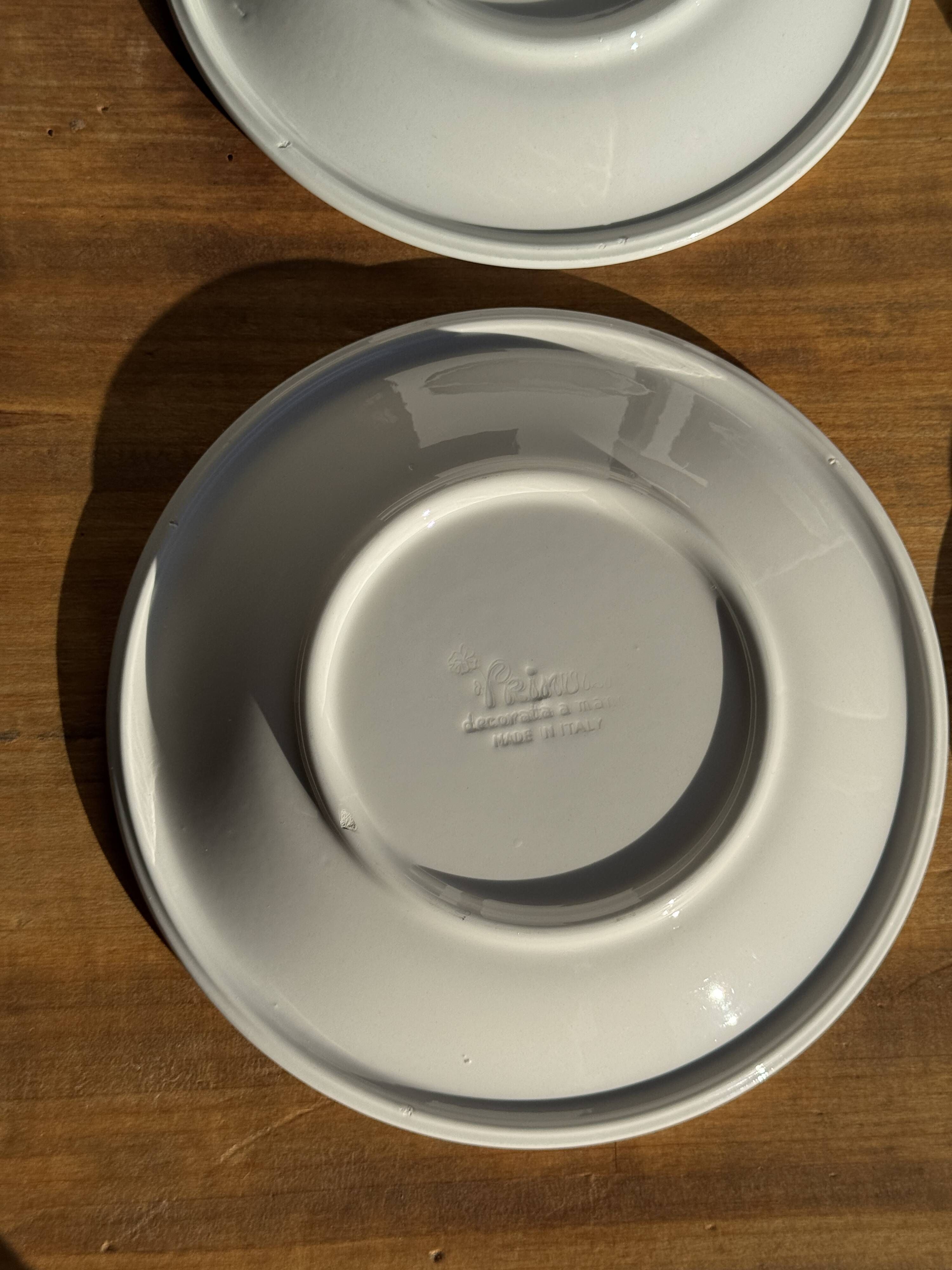 Set of 9 small Italian dessert plates Primula with red and green trim.