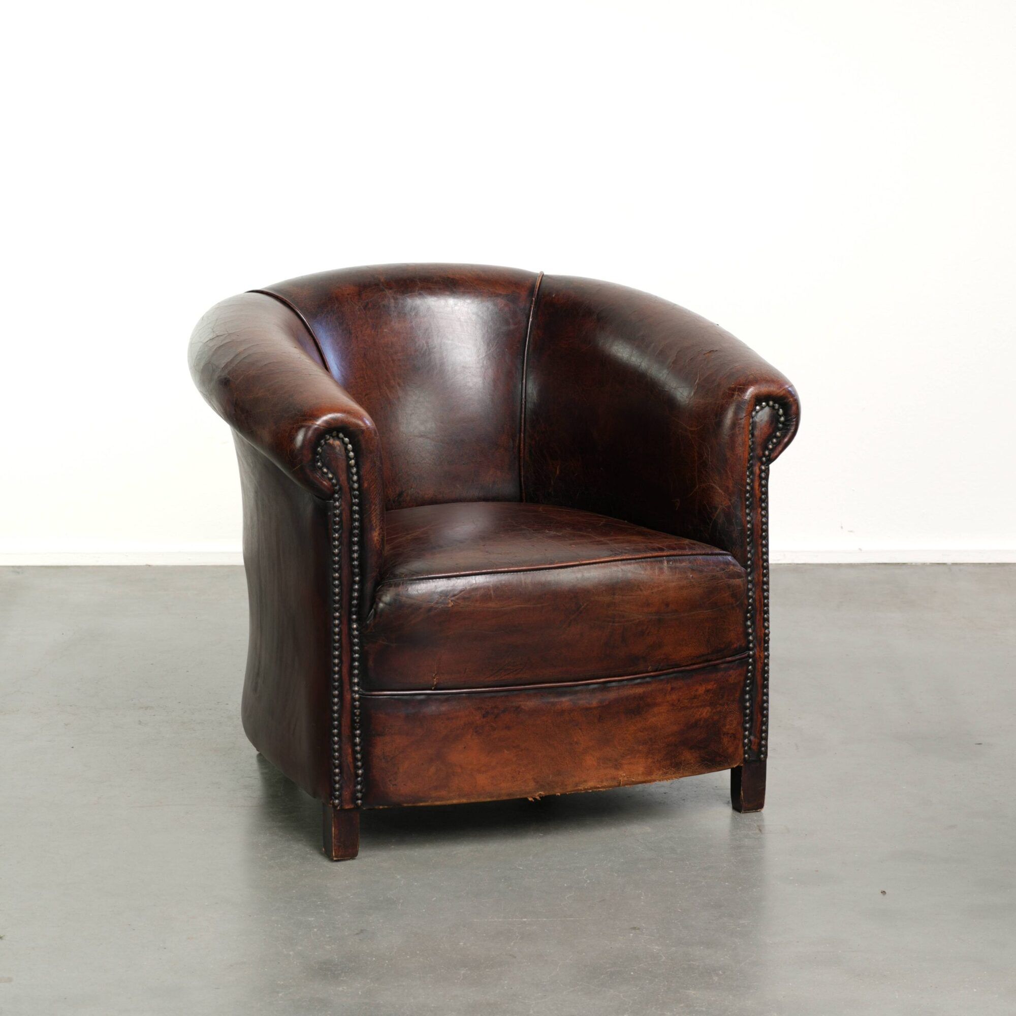 Vintage sheepskin club armchair with beautiful colours and a subtle size