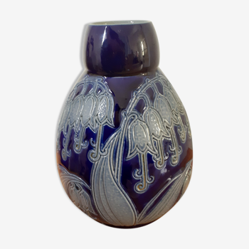 Blue vase decorated with flowers