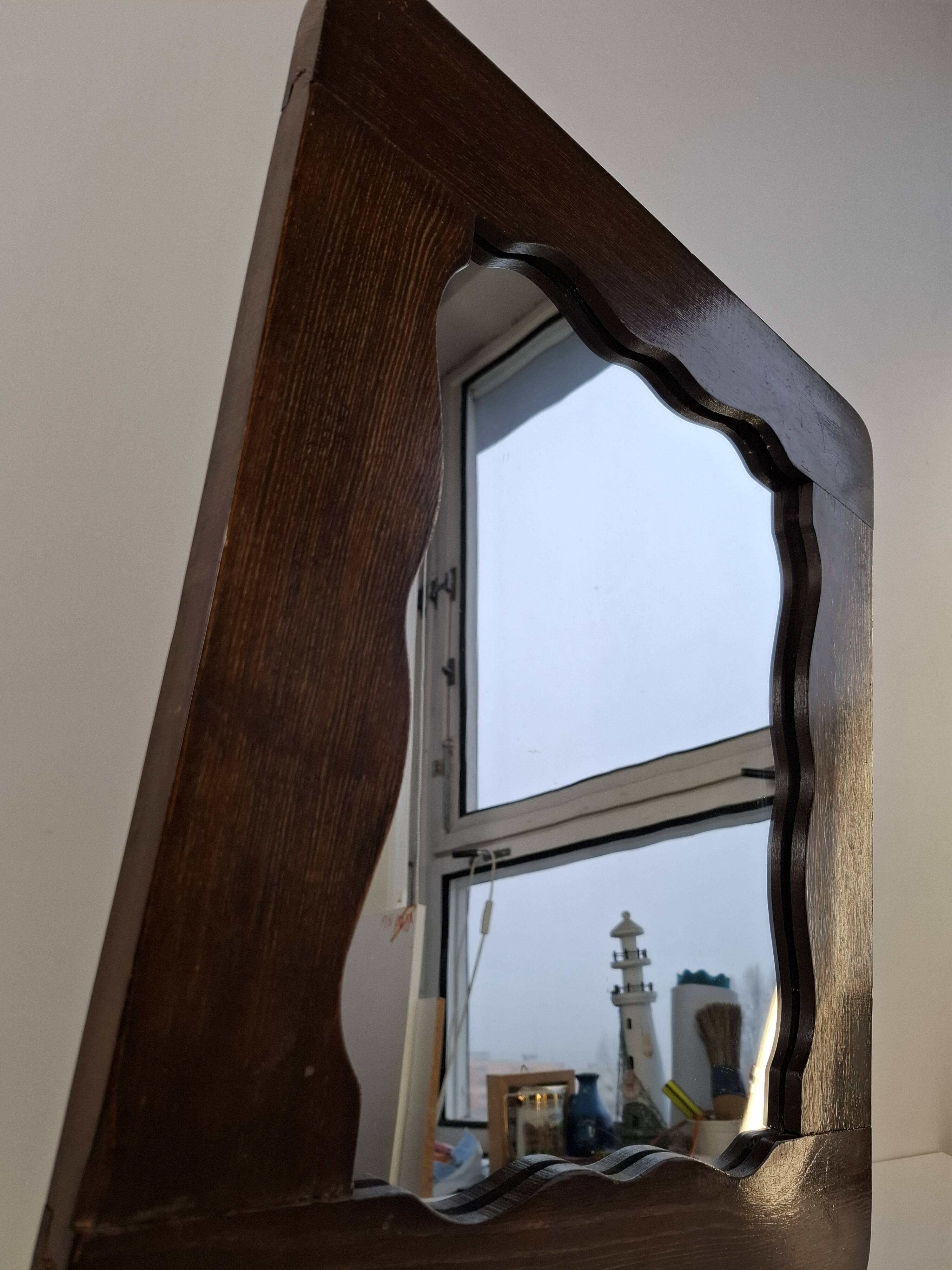 Czechoslovakian wall mirror with a wavy wooden frame, mid-century, 1940s