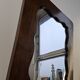 Czechoslovakian wall mirror with a wavy wooden frame, mid-century, 1940s