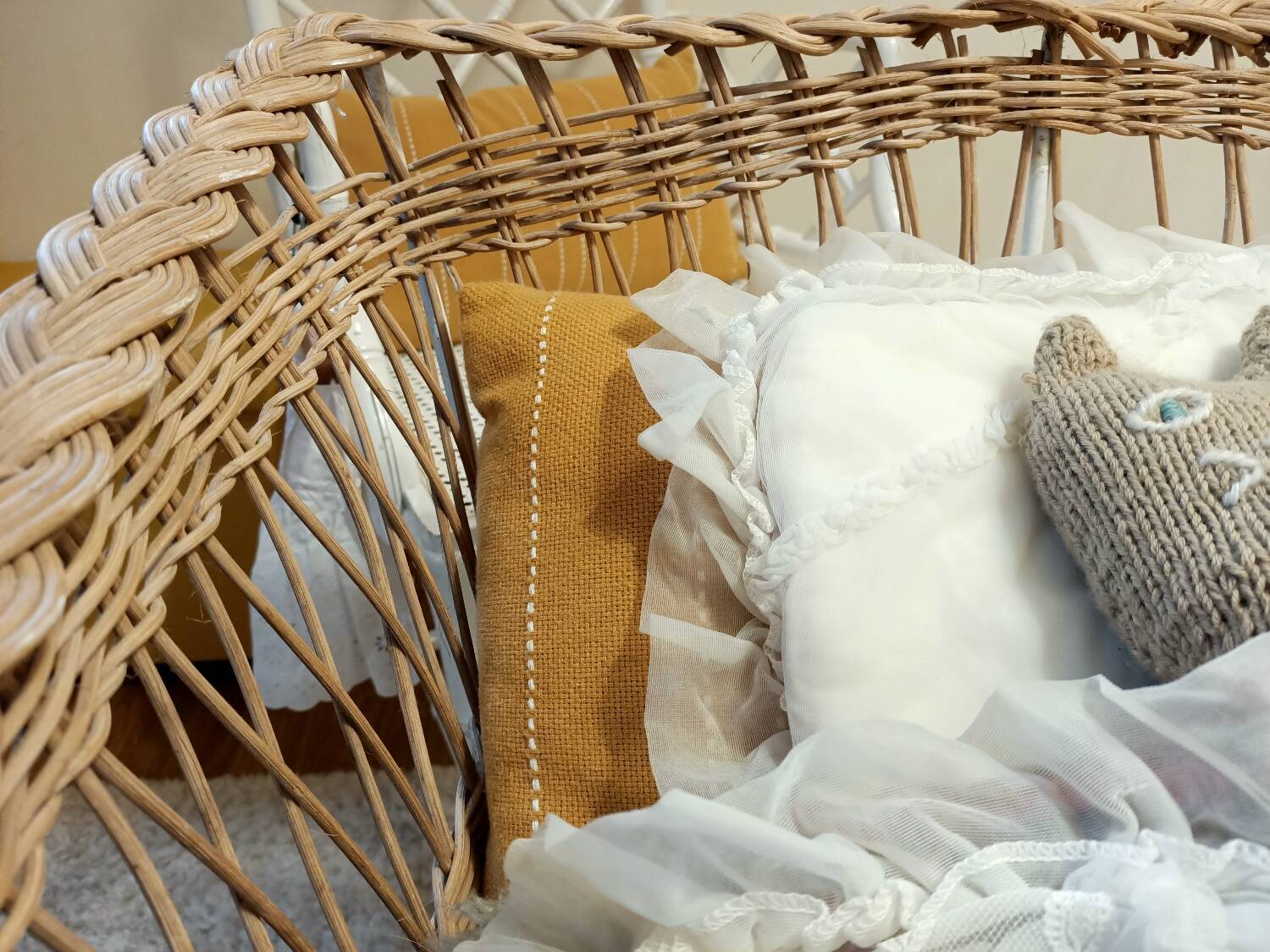 Rattan and wrought iron cradle